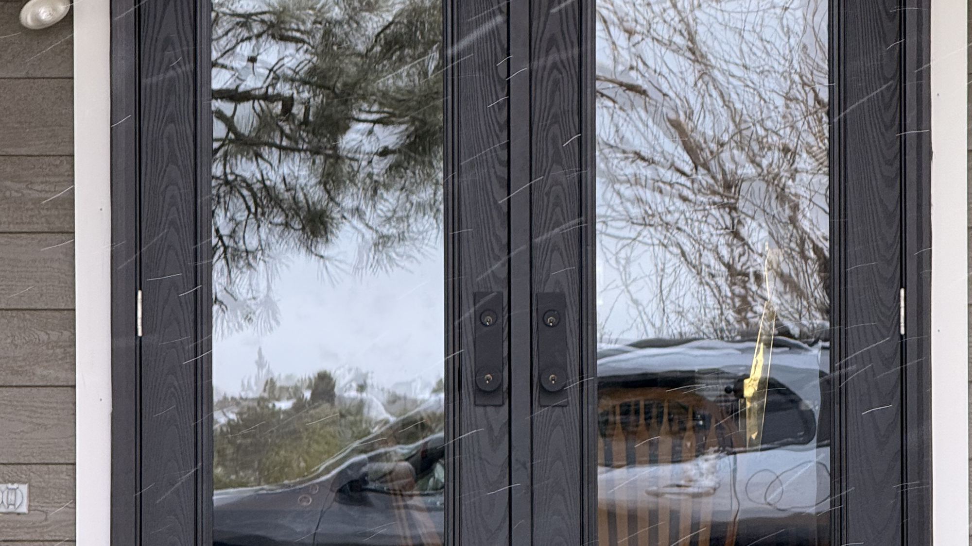 Black double French doors with full-height glass