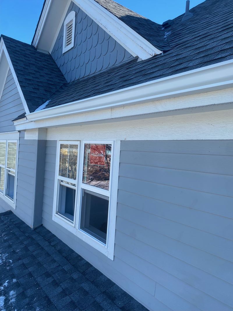 White windows on a blue house